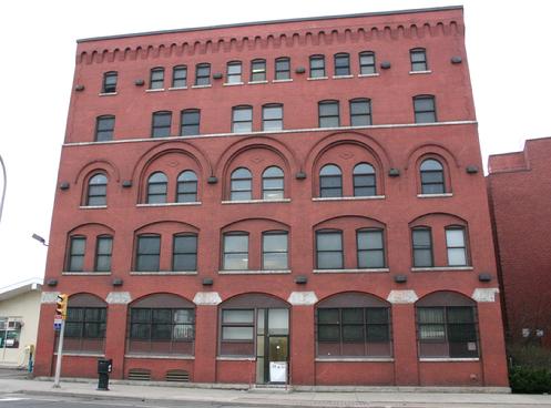 1201 Broadway: Built around 1900 for Stanislaus Lipowicz wholesale grocery. Designed by Wladyslaw Zawadzki. Later became Burnham's Department Store. Currently restored for housing.