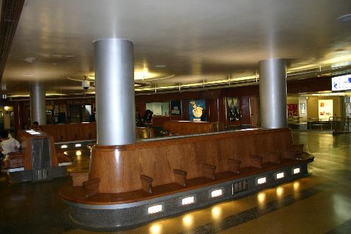 Passenger waiting area feature curved wooden benches. TH&B Hamilton