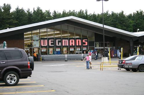 The Wegman�s Fairport Road store can be classified as an example of �mid-century� modern architecture. They style is usually defined as buildings constructed between the mid-1950s through the late 1960s. Typical mid-century architecture features include abstract shapes and curves, innovative use of materials, and a sense of humor and optimism. People also refer to this period as "googie", "jetset", "space age", "Jetsons", "populuxe", etc.