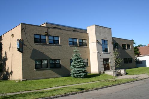 385 Paderewski Drive (image 2009). Built in 1949 as the Adam Plewacki VFW Post #799. An example of streamlined-modern architecture. Designed by Joseph Fronczak. Current called, Polonia Hall, is managed by the Urban Center.